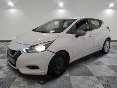the white car is parked on a checkered floor in the garage