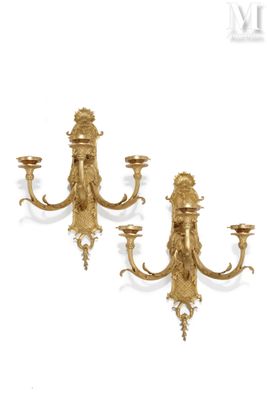 pair of antique brass wall sconces with lion heads on each of them