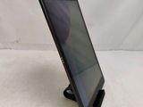 a close up of a tablet on a stand on a white surface