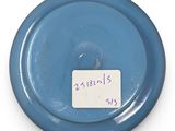 a small blue plate with a tag on it