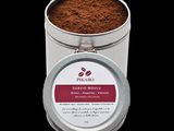 coffee powder in a tin with a lid on a black background