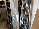 a pile of metal items in a garage with a box on the floor