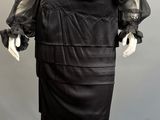 an image of a mannequin wearing a black dress on a mannequin mannequin mannequin mannequin mannequin mannequin mann