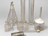 a lot of different glassware on the table