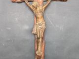wooden crucifix with jesus on the cross on a black background