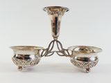 pair of silver plated candlesticks on a stand
