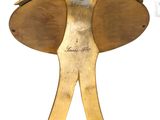 an image of a gold elephant statue with a large tusk on it ' s head