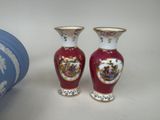 two vases sitting next to each other on a table
