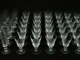 a lot of empty wine glasses sitting on a table
