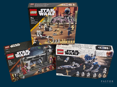 Trois coffrets Lego Star Wars sont exposés dans une boîte