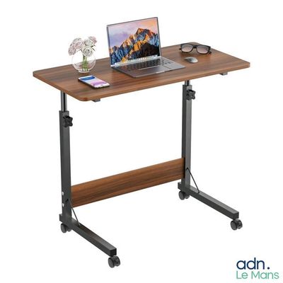 the laptop is sitting on top of a wooden desk