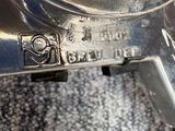 a close up of a metal object on a carpet