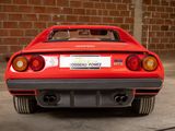 a red sports car that is parked in a garage