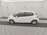 a picture of a white car parked in a garage