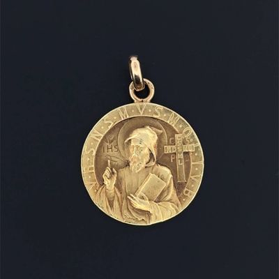 une image représentant une médaille d'or sur laquelle figure le portrait d'un homme