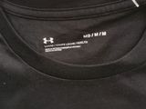 a close up of a black and white shirt on a table