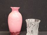 two vases sitting next to each other on a table