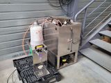 a machine that is sitting on a pallet next to a stair
