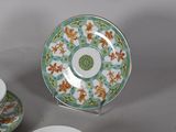 a tea cup and saucer sitting on a table