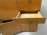 a wooden cabinet with two drawers and a door