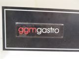 a sign that says gamgasto on the side of a wall