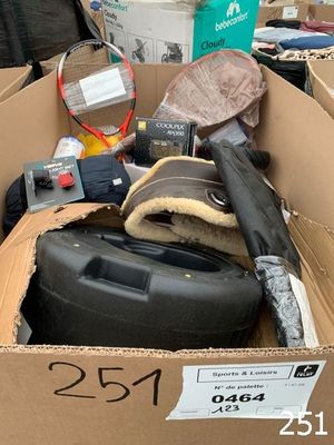 a cardboard box filled with assorted items for sale