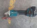 a picture of a cordless tool laying on the ground
