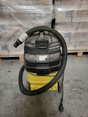 a vacuum that is sitting on a cart in a warehouse