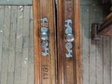 two wooden doors that are on the floor next to each other