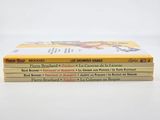 a stack of three children ' s books sitting on top of each other