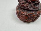 a small wooden box with a lid on a table