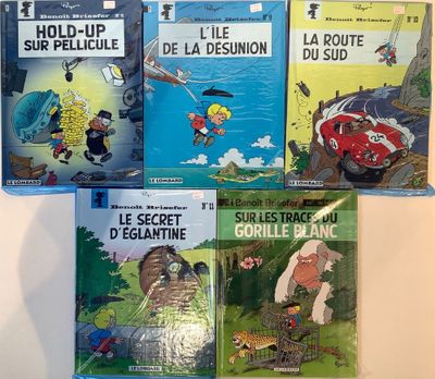 four children ' s books are lined up on a white surface