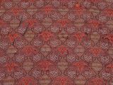 a close up of a red and green paisley print fabric