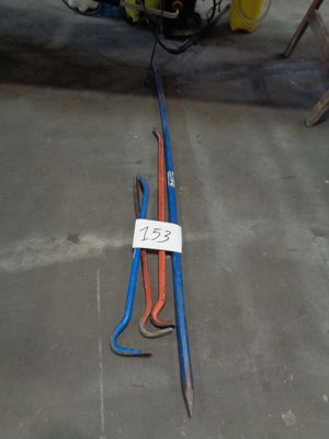 a blue and orange hose laying on the ground next to a yellow and red hose