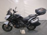 a picture of a white and black motorcycle parked on a checkered floor
