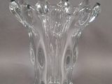 a glass vase that is sitting on a table