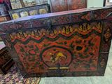 a chest with a design on it in the middle of a room