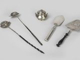 a group of silverware items including spoons, spatula, and other items