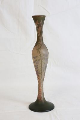a vase that is sitting on a stand on a white background