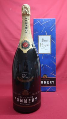 a close up of a bottle of champagne next to a box of chocolate