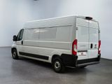 an image of a white van parked in a room
