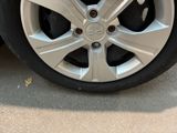 a close up of a tire on a car ' s rim