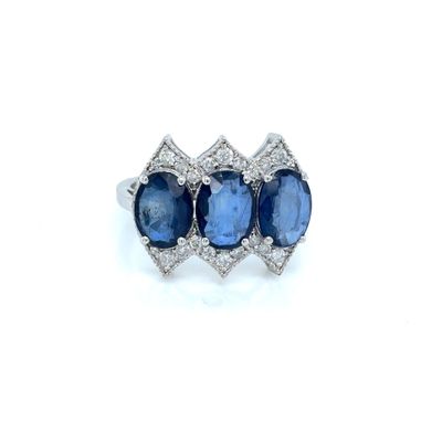 a three stone sapphire and diamond ring