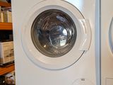 two washers and a dryer stacked on top of each other
