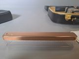 a comb and a bag on a table next to a pair of shoes