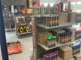 many cans and cans of soda on the shelves in the store