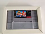 a nintendo game in a white box on a table