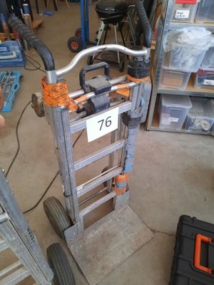 a small hand truck with a number on it in a garage