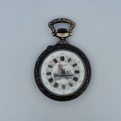 a pocket watch that has a clock on the front of it