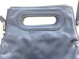 an image of a purse with a handle on a white background
